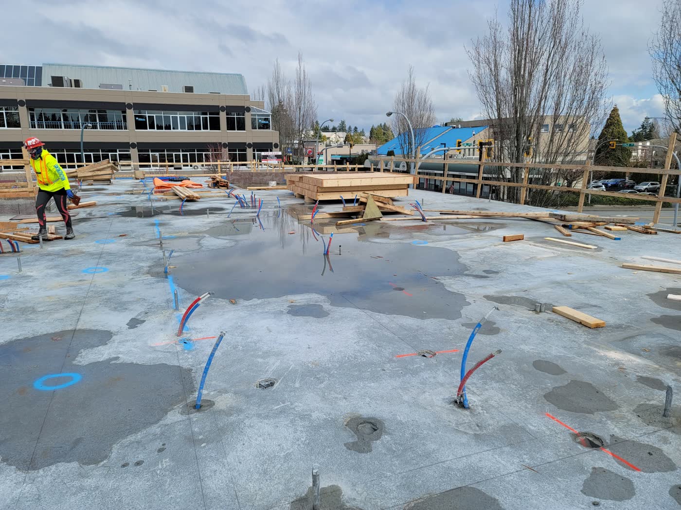Podium slab with standing water and scattered material