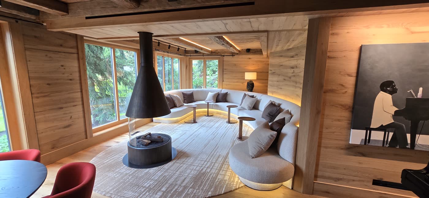 Timber-lined living room with exposed beams
